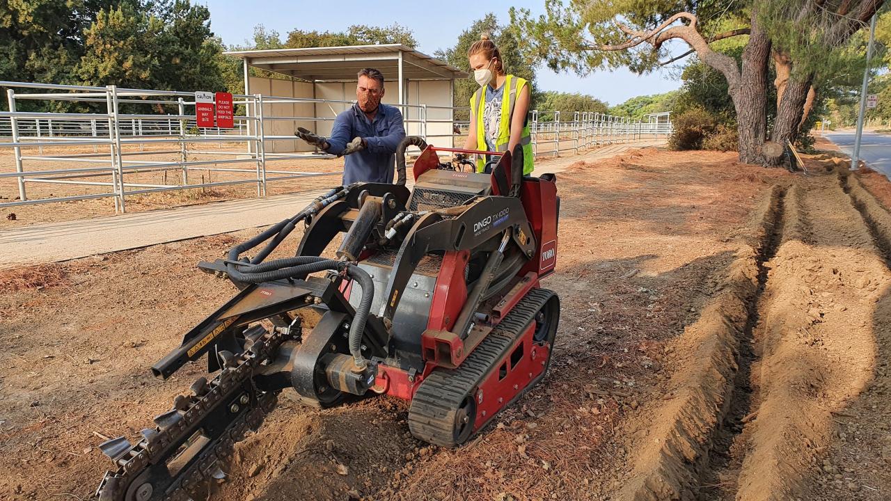 Miles Daprato and Rain Butler installing drip irrigation at the AquaFree garden site along Garrod Drive in the west end of the Arboretum. Miles Daprato and Rain Butler installing drip irrigation at Aqua Free garden site