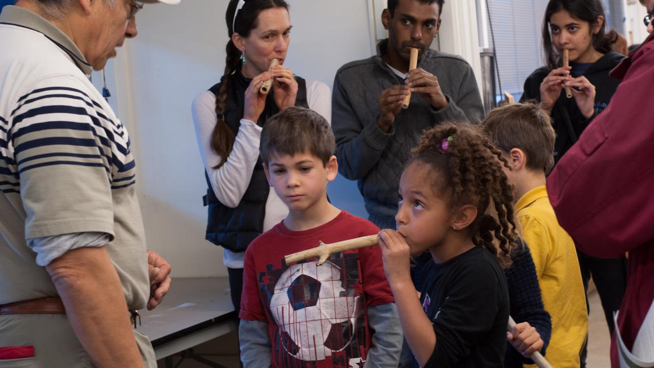 kids learning how to play the flute