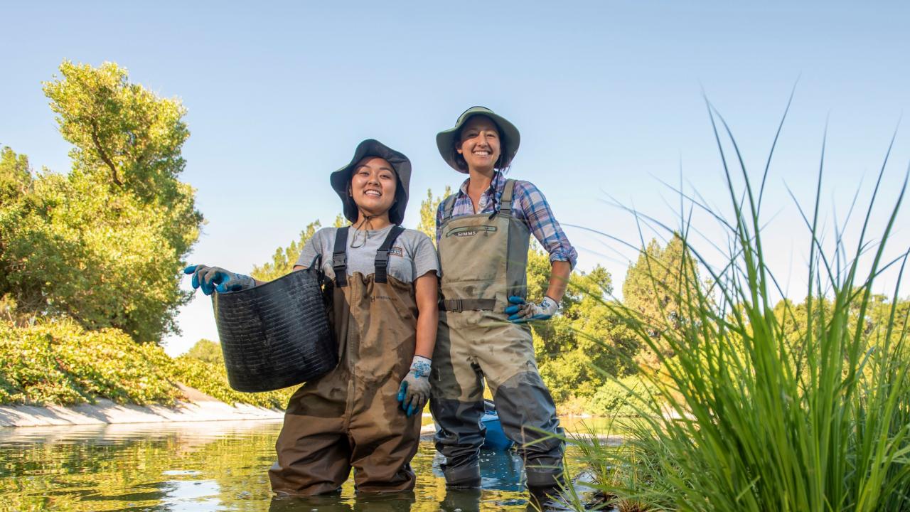 Waterway Stewardship intern Noreen Mabini (left) gains real-world experience working with her staff mentor and Waterway Steward Nina Suzuki (right) on stormwater management in urban settings. Photo of Noreen Mabini and Nina Suzuki