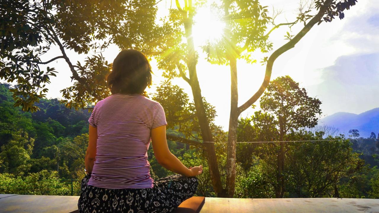 Woman meditating in nature