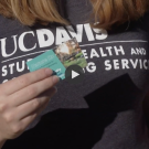 Close up of a person holding a Nature Rx business card